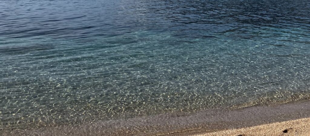 crystal clear water and sand in Herceg Novi, Montenegro