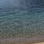 crystal clear water and sand in Herceg Novi, Montenegro