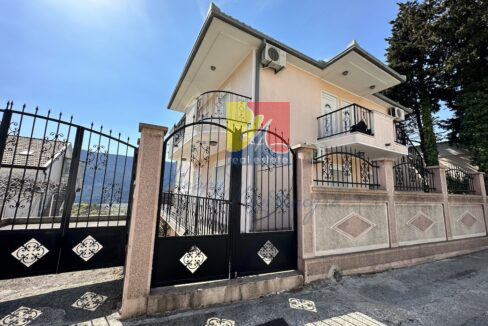 three-storey house with a gate view