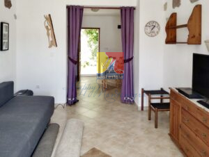 living room with an open door leading to the garden, house in Herceg Novi by the sea