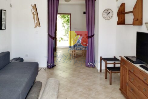 living room with an open door leading to the garden, house in Herceg Novi by the sea