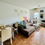 living room with windows facing the sea, apartment in Igalo