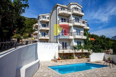 real estate in Herceg Novi, apartment by the sea, view over the building with a pool